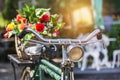 Vintage bicycle with bouquet flowers in basket Royalty Free Stock Photo