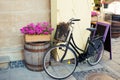 Vintage bicycle with flower basket and chalk board near cafe Royalty Free Stock Photo