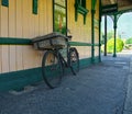 Vintage bicycle. Grocery home deliveries. Station platform