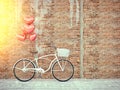 Vintage bicycle parked beside wooden wall.