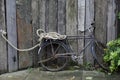 Vintage bicycle tied with rope showing old bike against wooden fence Royalty Free Stock Photo