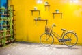 Vintage bicycle on vintage yellow wall Royalty Free Stock Photo