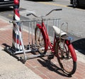 Vintage bicycle with a white banana seat in a bike rack Royalty Free Stock Photo