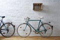 Vintage bicycle in white brick studio Royalty Free Stock Photo