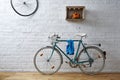 Vintage bicycle in white brick studio Royalty Free Stock Photo