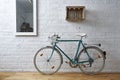 Vintage bicycle in white brick studio Royalty Free Stock Photo