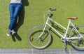 Vintage bike and cyclist on lawn Royalty Free Stock Photo