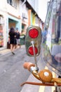 Vintage bike mirror closeup view on shopping street Royalty Free Stock Photo