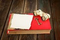 Vintage binoculars on red ancient book with blank page for text. nostalgic vintage background Royalty Free Stock Photo