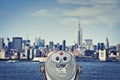 Vintage binoculars viewer, Manhattan skyline with the Empire State Building, New York City USA Royalty Free Stock Photo