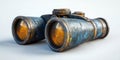 Vintage binoculars with a weathered finish resting on a flat surface in natural light Royalty Free Stock Photo
