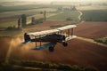 A vintage biplane flying low over a vast farmland, with a farmer waving from below.