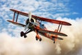 Vintage biplane performing aerobat in sky with clouds of smoke. Generative AI Royalty Free Stock Photo