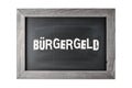 Vintage black board with wooden frame and german word Buergergeld ( engl. citizen money) isolated on white background. Royalty Free Stock Photo