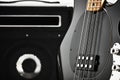 Vintage black electric bass guitar with an amplifier Royalty Free Stock Photo