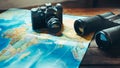 Accessories for travel Vintage Film Camera, Map And Binoculars On Wooden Table, Front View. Adventure Travel Scout Journey Concep Royalty Free Stock Photo