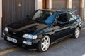 Vintage black Ford Escort RS Cosworth MK5 rally sports car parked on the street in Soller, Spain