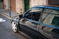 Vintage black Ford Escort RS Cosworth MK5 rally sports car parked on the street in Soller, Spain