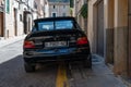 Vintage black Ford Escort RS Cosworth MK5 rally sports car parked on the street in Soller, Spain