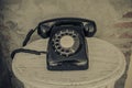 Vintage black phone on old walls background Royalty Free Stock Photo
