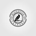 Vintage black raven or crow logo vector illustration design