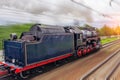 Vintage black steam locomotive train fast rush railway, back view Royalty Free Stock Photo