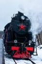 Vintage black steam locomotive train rush railway. winter Royalty Free Stock Photo