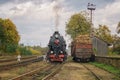 Vintage black steam locomotive train on railway station. Royalty Free Stock Photo