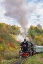 Vintage black steam locomotive train with wagons on railway. Royalty Free Stock Photo