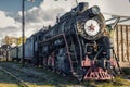 Vintage black steam locomotive train with wagons on station. Royalty Free Stock Photo