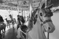 Vintage black and white image of an amusement park carousel