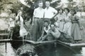 Vintage black and white photo of a group of young people 1950s European.