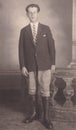 Vintage black and white photo of a handsome young man in horse riding outfit 1940s?