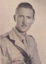 Vintage black and white photo of a handsome young man in military uniform1940s?