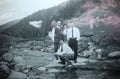 Vintage black and white photo of men and women in the countryside, 1950s European.