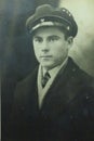 Vintage black and white photo of a young man in uniform 1950s European.