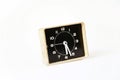 vintage black and white used dirty square clock  on white background. time concept. Royalty Free Stock Photo