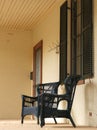 Vintage black wicker chairs on historic brick Lorenzo mansion