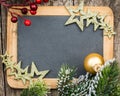 Vintage blackboard blank framed in Christmas tree branch and dec Royalty Free Stock Photo