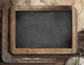 Vintage blackboard with treasure map, old compass Royalty Free Stock Photo