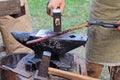 Vintage blacksmith tools on wooden table