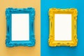 Vintage blank blue and yellow photo frames over double colorful background. Ready for photography montage. Top view from above. Royalty Free Stock Photo