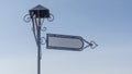 Vintage blank directional road signs against blue sky. White metal arrows on the signpost. Royalty Free Stock Photo