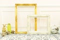 Vintage blank golden and white wooden frames and decorative thin Royalty Free Stock Photo