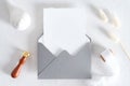 Vintage blank paper card mockup in open envelope, greeting card design for wedding or birthday. Top view with copy space. Romantic Royalty Free Stock Photo