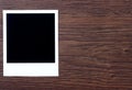 Vintage blank photos on wooden table Royalty Free Stock Photo