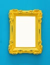 Vintage blank yellow photo frame over blue background. Ready for photography montage. Top view from above.