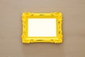 Vintage blank yellow photo frame over gray background. Ready for photography montage