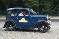 Vintage blue Austin Seven at retro car race track