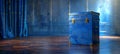 Vintage blue ballot box on wooden floor on the stage. Retro blue chest. Concept of voting, democracy, elections